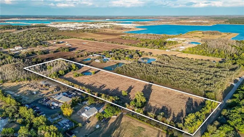 View of property location with property parcel outlined and a large body of water