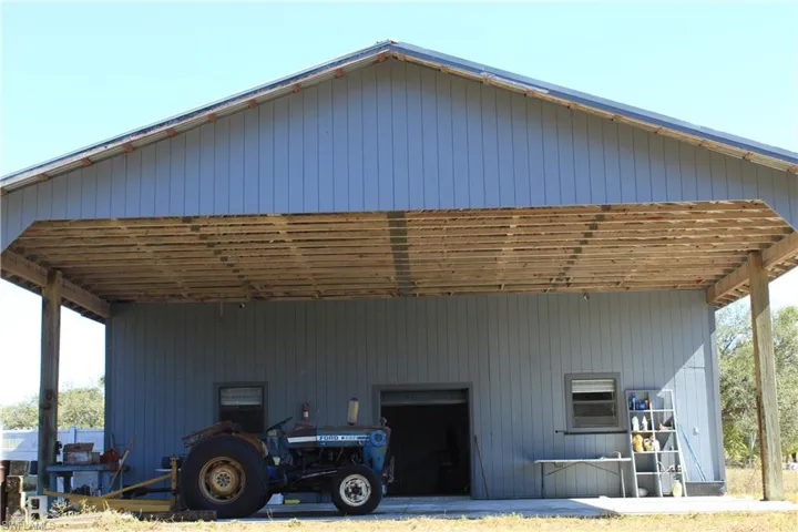 View of outdoor structure with a carport