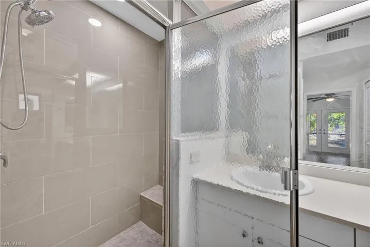 Full bathroom with a stall shower and a garden tub