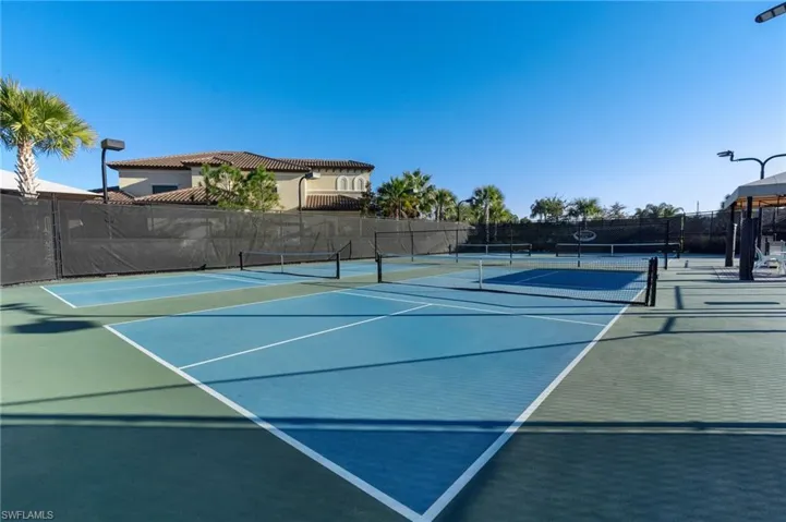 View of tennis court featuring community basketball court