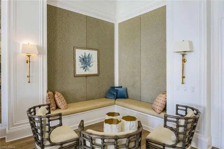 Sitting room with wood finished floors and baseboards