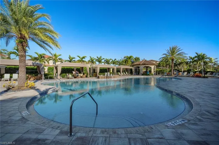 Community pool with a patio area and a gazebo