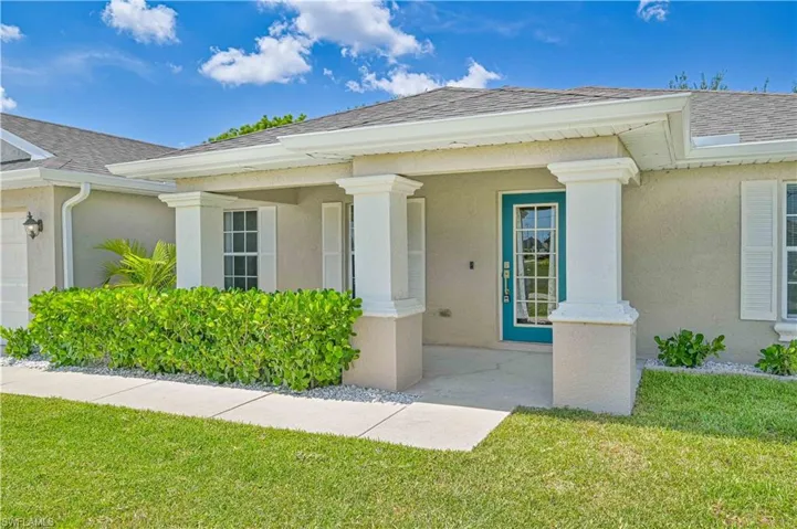 Property entrance featuring a lawn