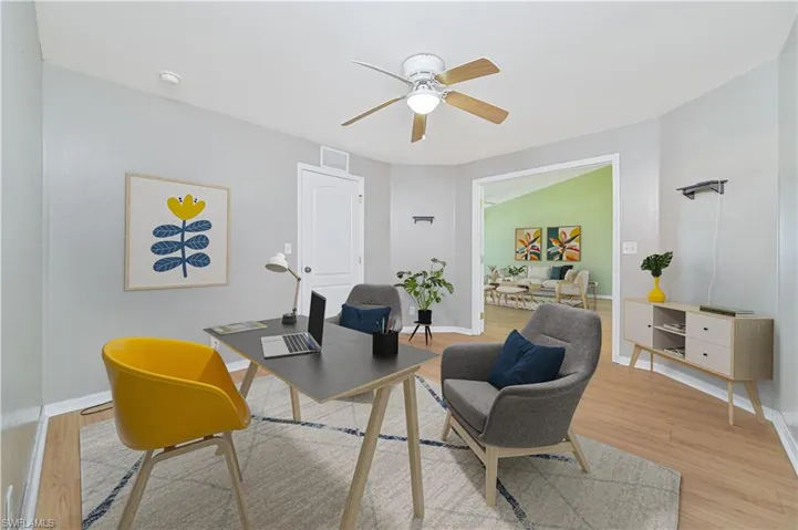 Office featuring ceiling fan and light hardwood / wood-style flooring