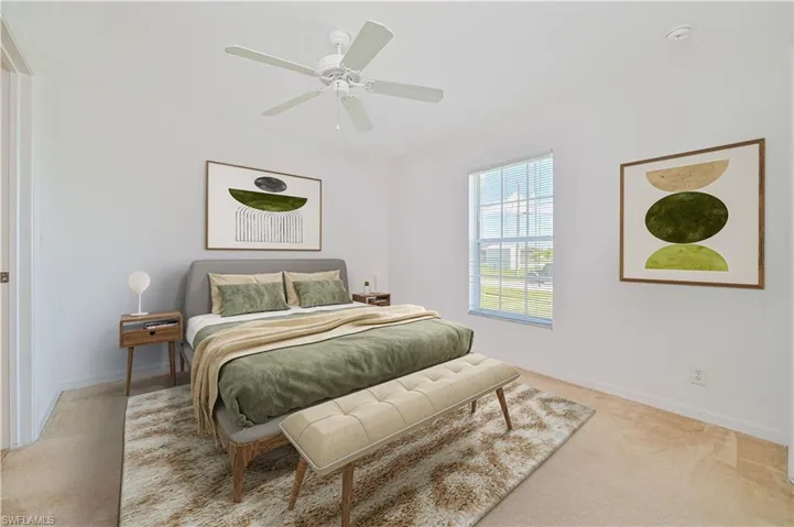 Carpeted bedroom with ceiling fan