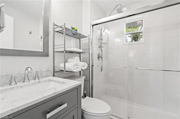 Renovated bathroom: spacious shower with rainhead and sprayer