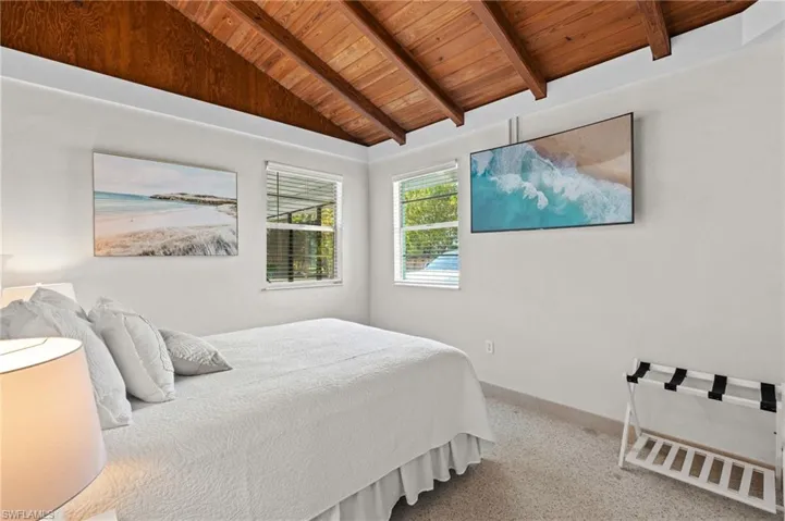 Bedroom also has vaulted ceilings and a flatscreen tv