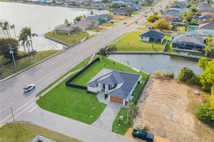 Aerial view of residential area with a large body of water