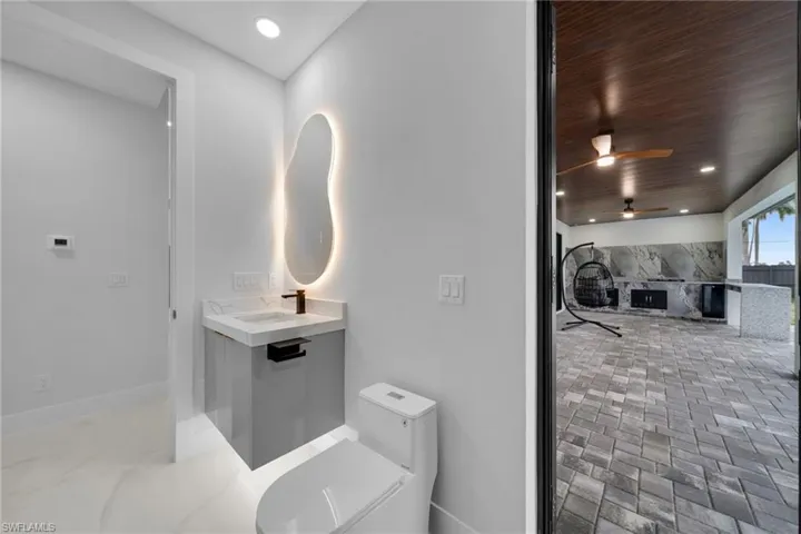 Full bath with recessed lighting, vanity, ceiling fan, and wood ceiling