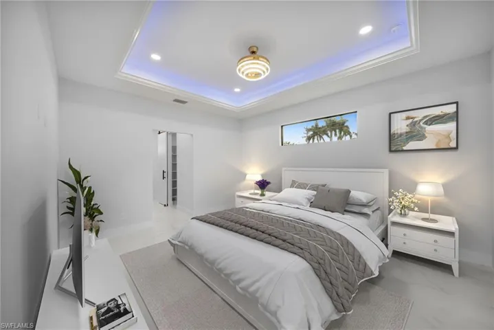 Bedroom with recessed lighting and a raised ceiling