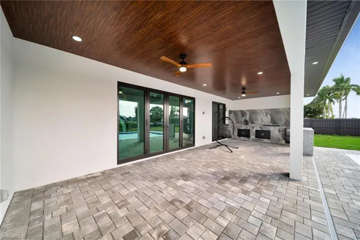 View of patio with a ceiling fan