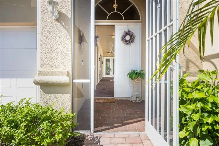 Entrance to property featuring a garage