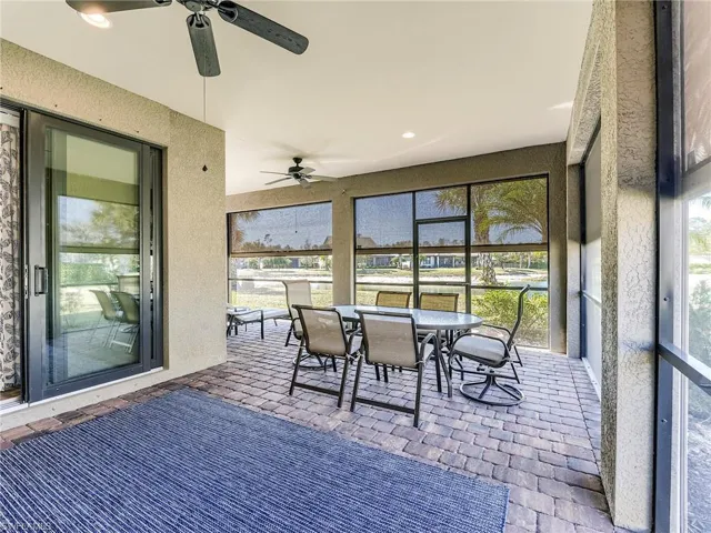 The lanai is protected by electric Storm Smart roll down hurricane screens