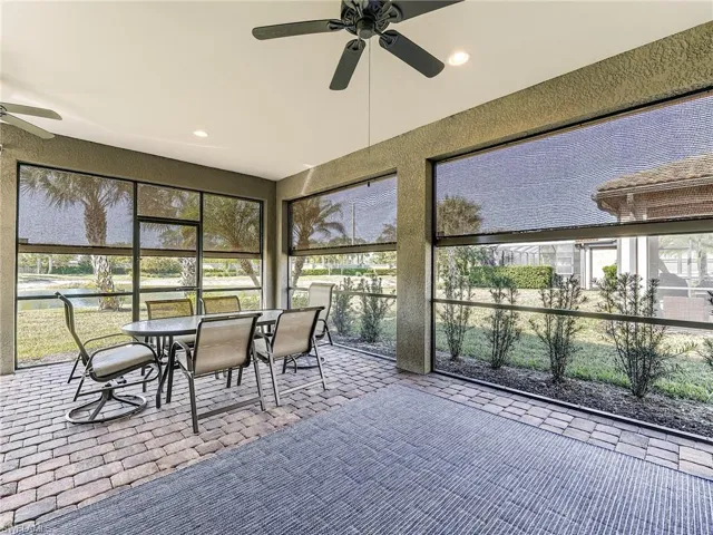 The lanai is protected by electric Storm Smart roll down hurricane screens
