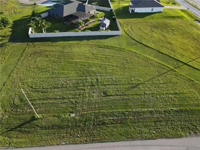 Birds eye view of property with a rural view
