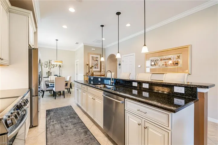 Galley Kitchen with upgraded lighting, cabinets and granite