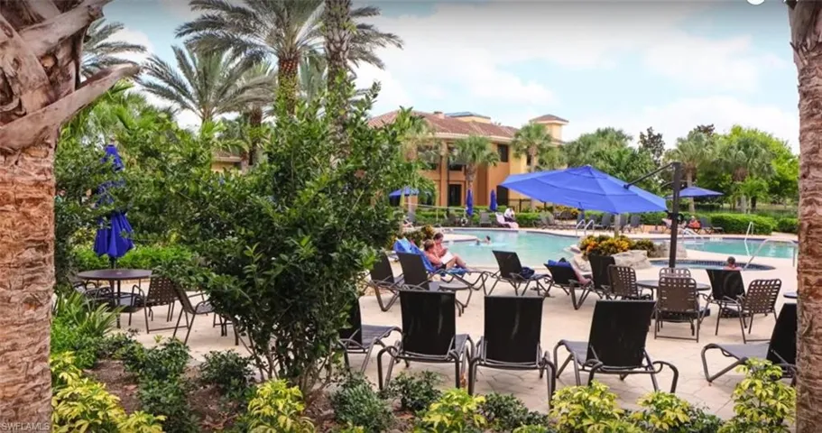 Community pool featuring a patio