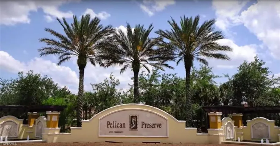 Community sign with view of scattered trees