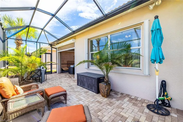 View of patio / terrace featuring a sunroom and glass enclosure