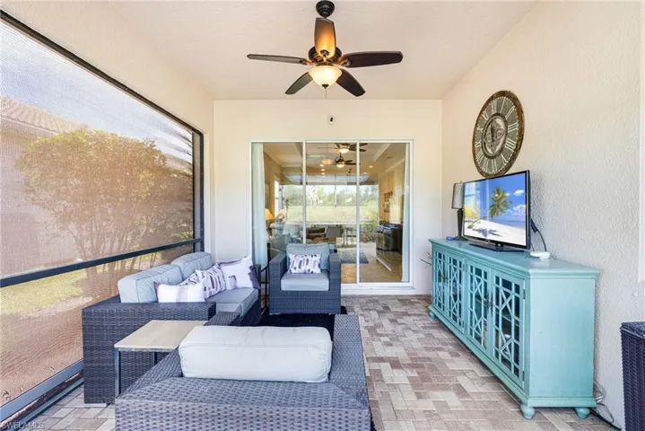 Lanai with ceiling fan and hurricane shutters