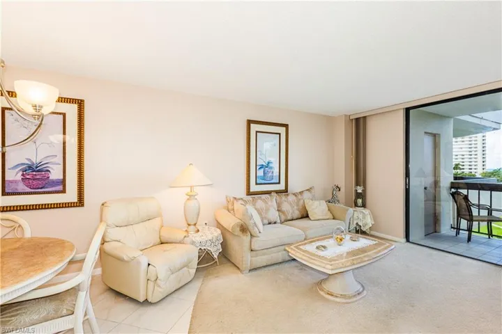 Living room featuring light carpet