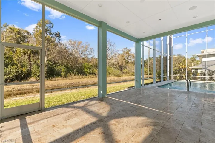 the screened in lanai features western exposure facing a preserve