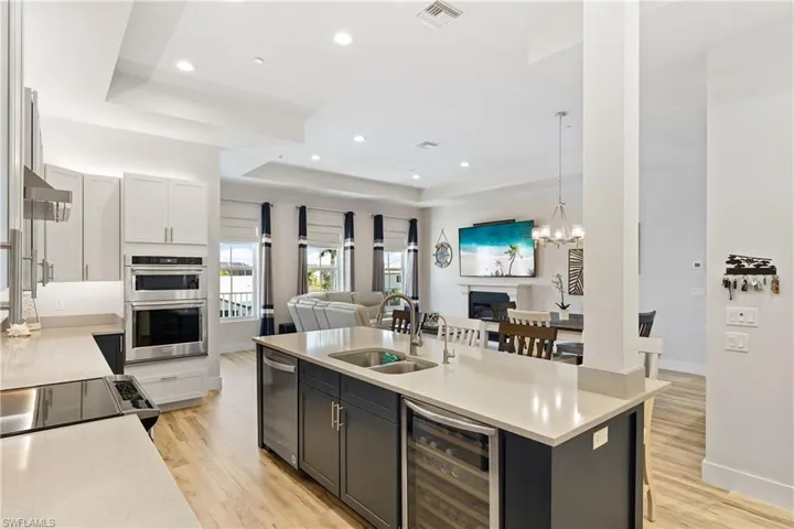 Kitchen features wall over in addition to a