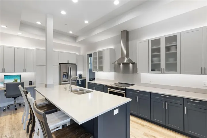 This stunning kitchen features an oversized island