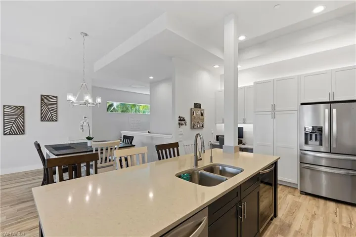 the open floor plan flows between living and dining area