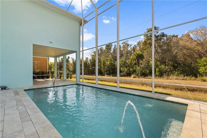This exclusive pool with water feature and special features