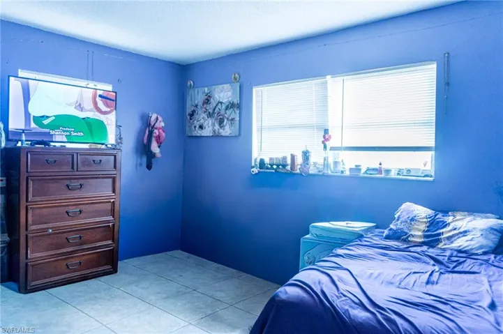 Bedroom featuring light tile patterned floors