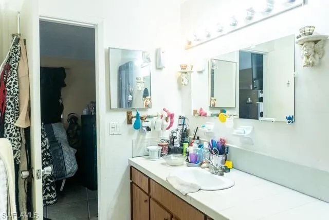 Bathroom featuring vanity and tile patterned floors
