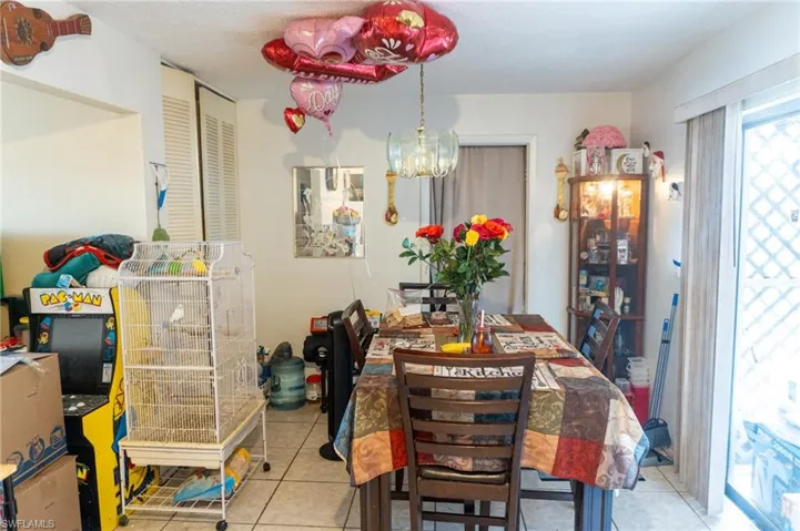 Dining space featuring light tile patterned floors
