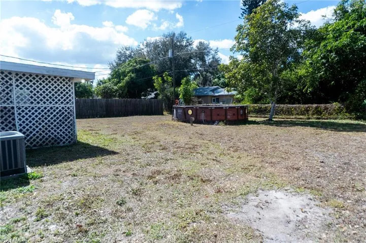 Fenced backyard featuring an outdoor pool