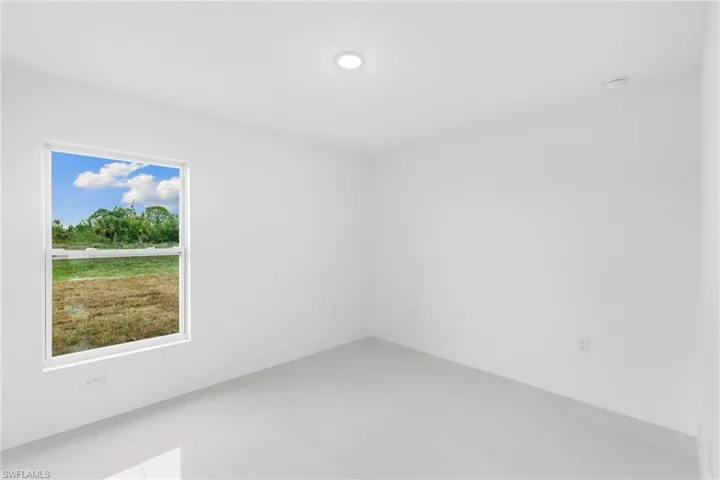 Spare room featuring baseboards