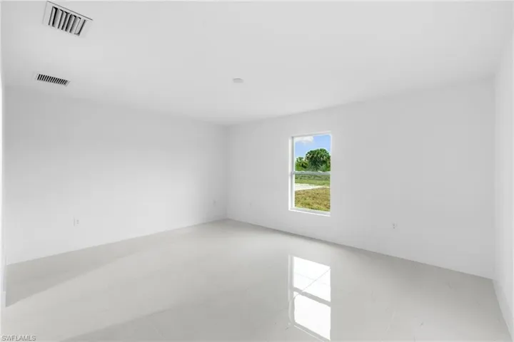 Empty room featuring baseboards