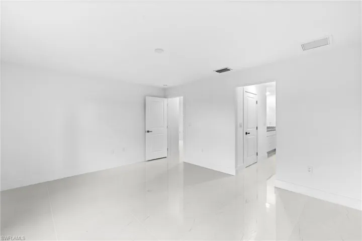 Unfurnished room featuring baseboards