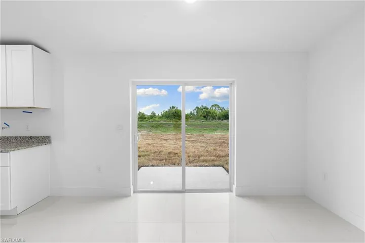 Unfurnished dining area featuring baseboards and light tile patterned floors
