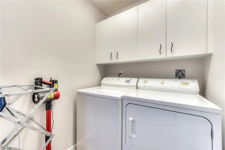 Laundry room with cabinets