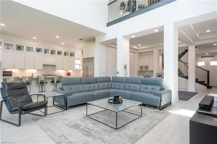 Living room featuring stairway and recessed lighting