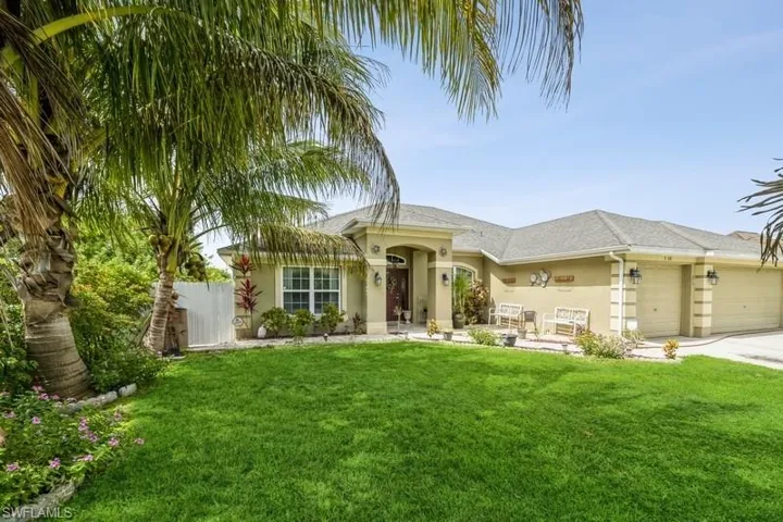 View of front of house with stucco siding, a garage, a shingled roof, and concrete driveway
