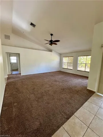 Plenty of light, great high angled ceiling, and ledge for decor.