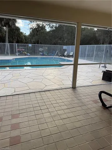 Clubhouse offers a nice screened-in area off the heated Community pool