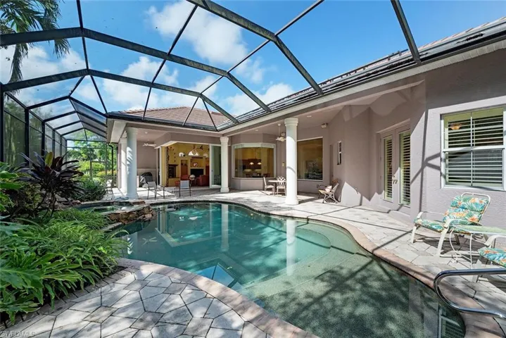 View of swimming pool, spa and lanai