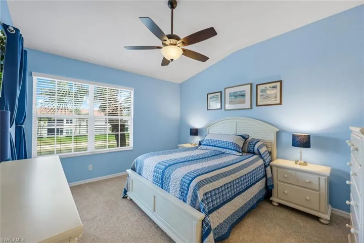 Spacious and bright primary bedroom with private access to the lanai, ensuite bathroom, a walk-in closet and additional closet.