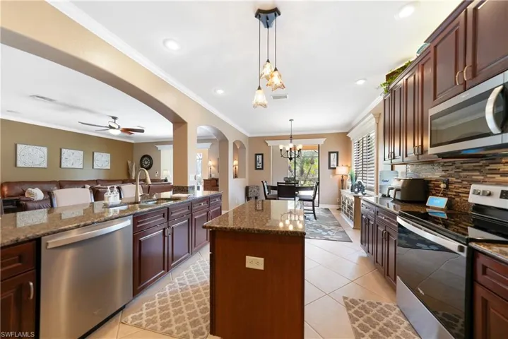 Beautiful kitchen with island and breakfast counter and eat in kitchen