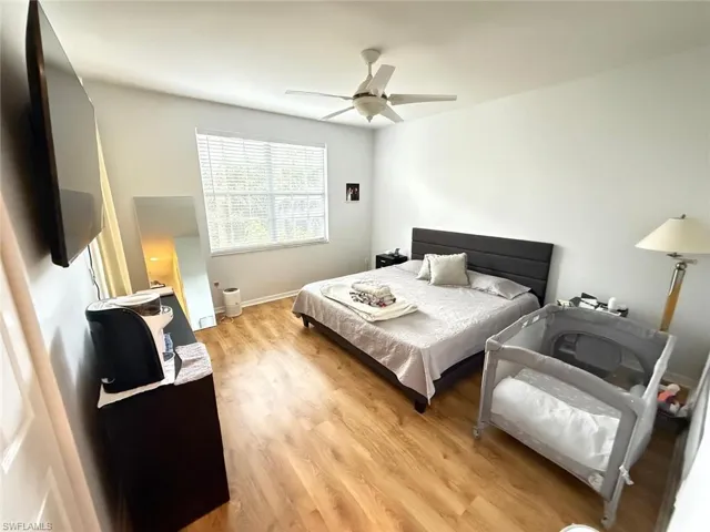 Bedroom featuring light wood finished floors and a ceiling fan