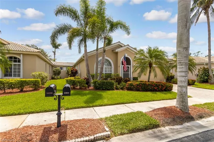 Mediterranean / spanish home with a front yard