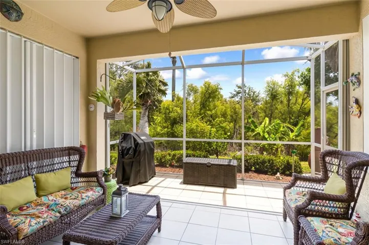 Sunroom featuring ceiling fan