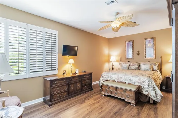 Bedroom featuring hardwood / wood-style floors and ceiling fan